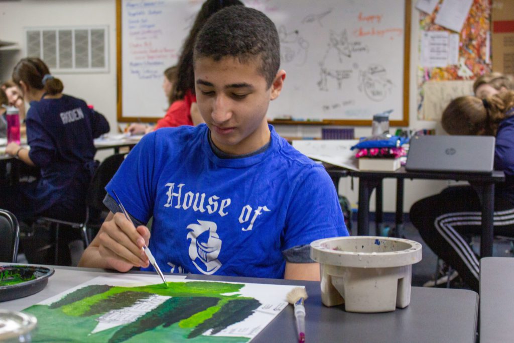 boy painting landscape picture