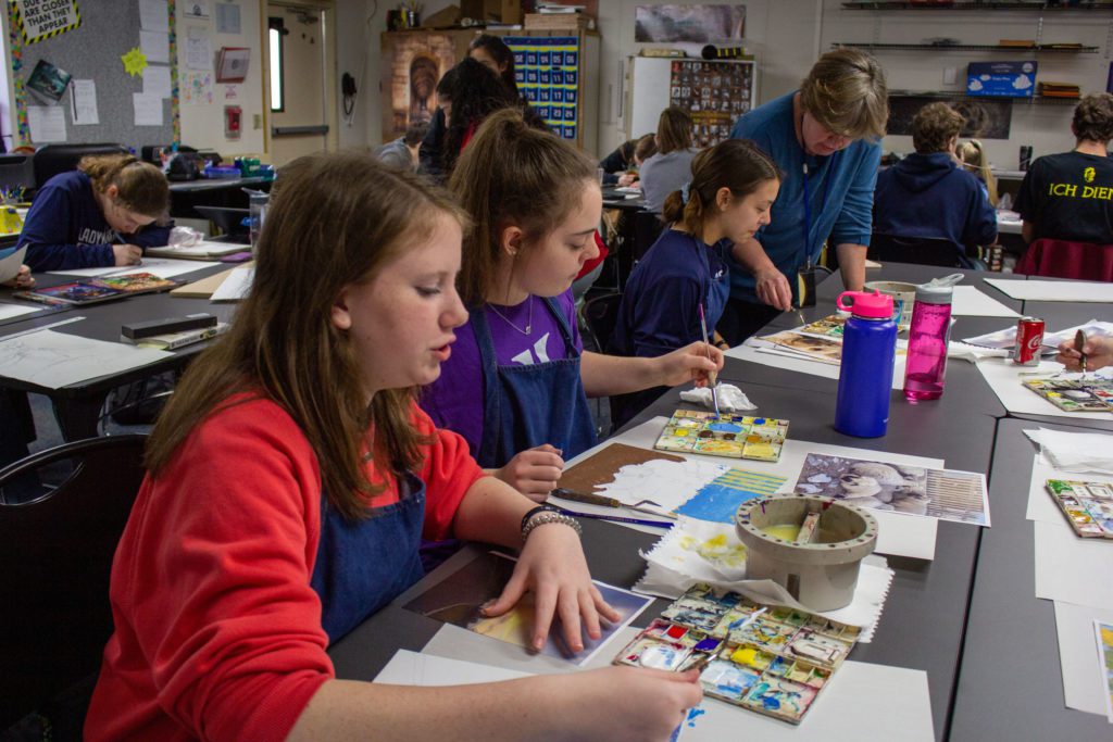 art class students painting landscapes